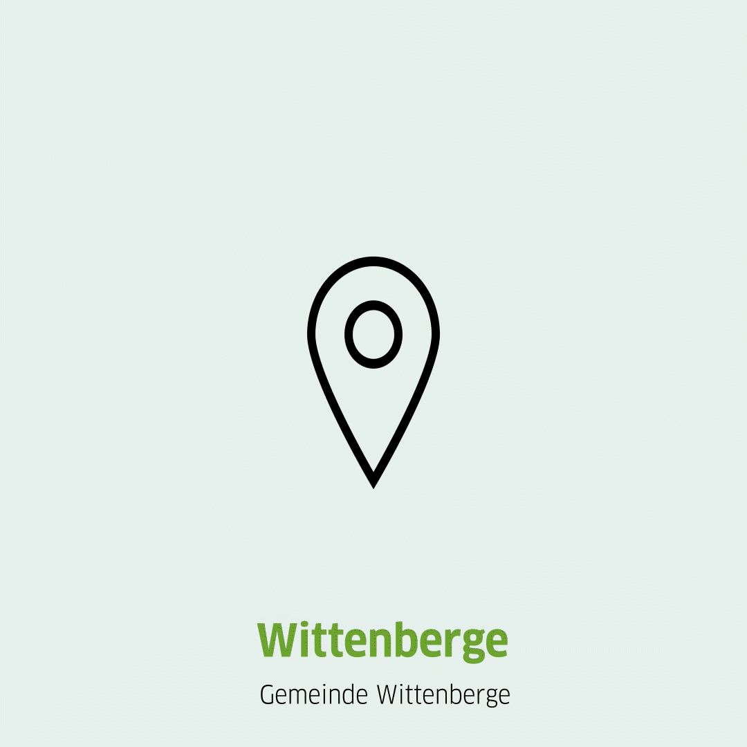 Springende Pinnnadel und Aufschrift des Standortes Wittenberge